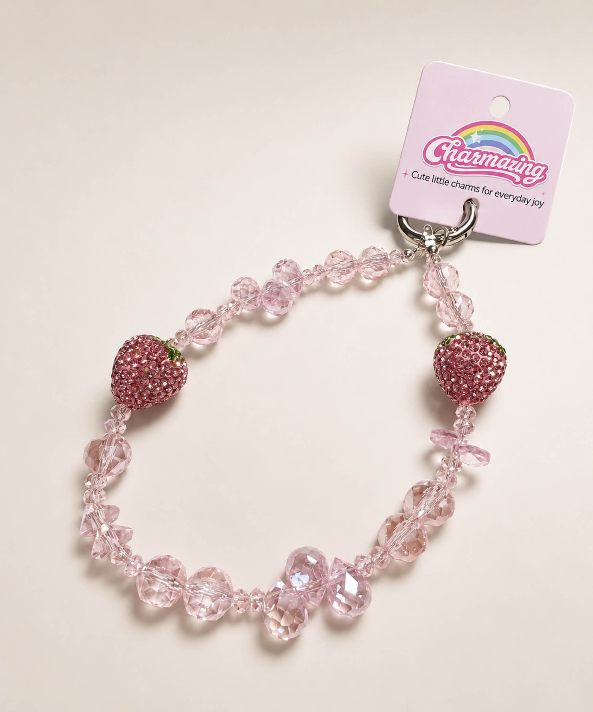 Pink strawberry beaded phone charm with crystal-style beads and sparkling strawberry accents